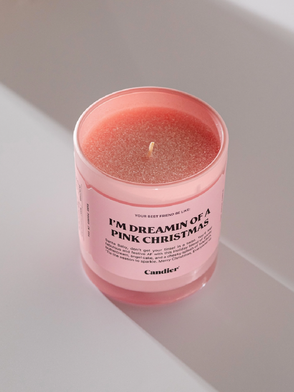 Pink Christmas candle topped with pink glitter