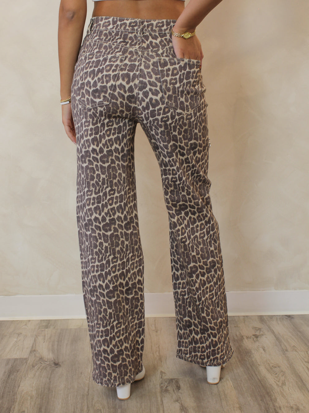 Leopard wide leg jeans with split thigh detail and rhinestone accent