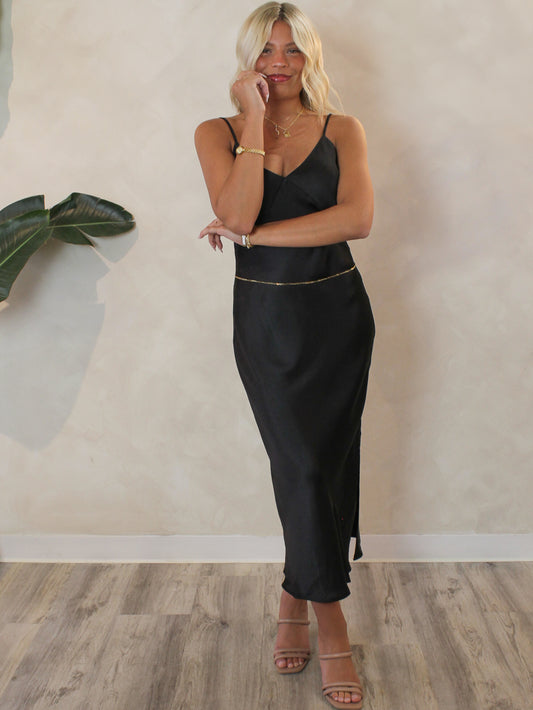 Black satin midi dress with subtle side slit
