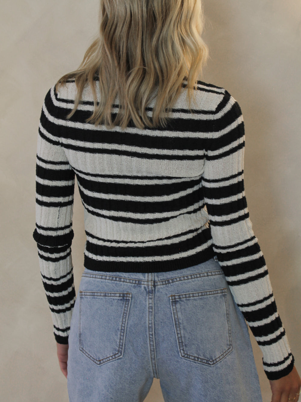 Woman wearing a black and white stripe sweater