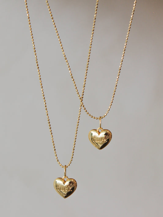 Gold Heart Necklace with the words Fuck & Love