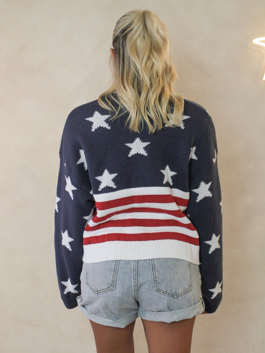 Back view of a woman wearing an American Flag sweater