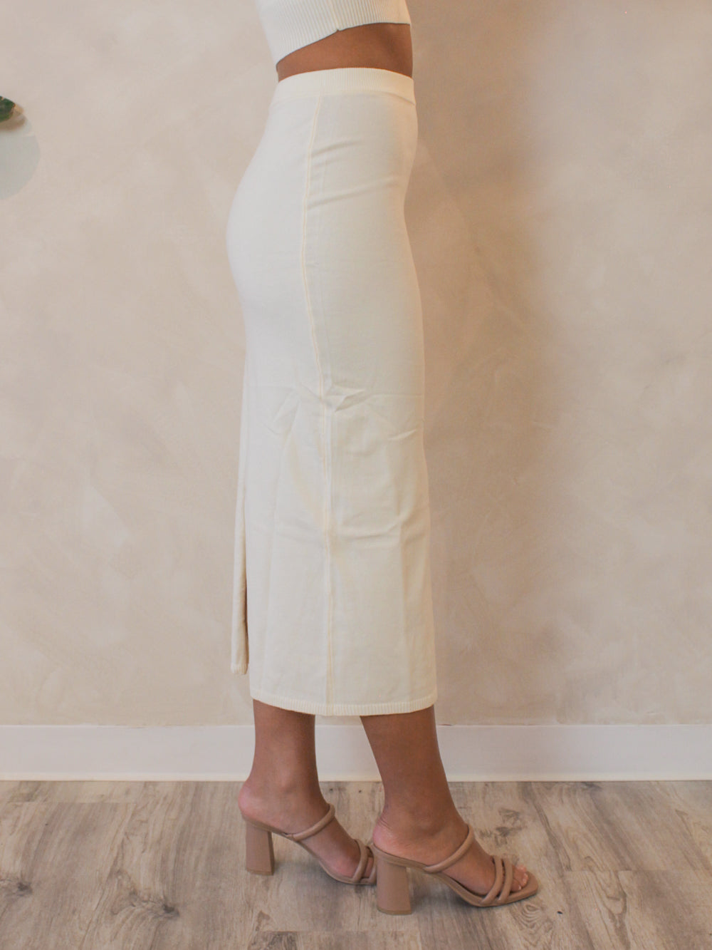 Fitted, light weight knit maxi skirt in a butter yellow color with a matching crop top