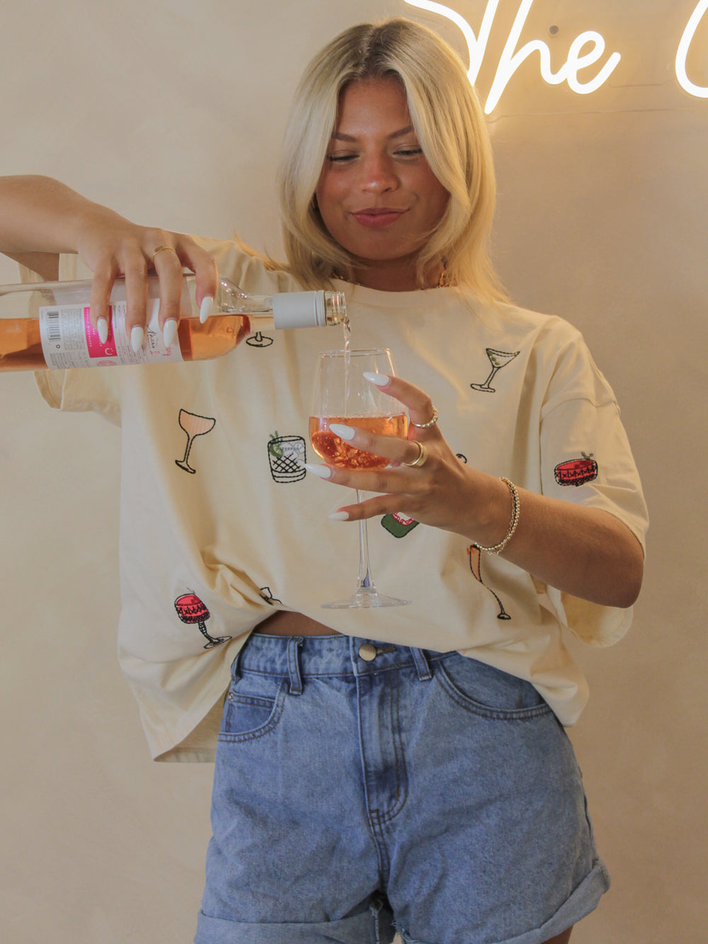 An oversized tee with cocktail theme graphics embroidered all over