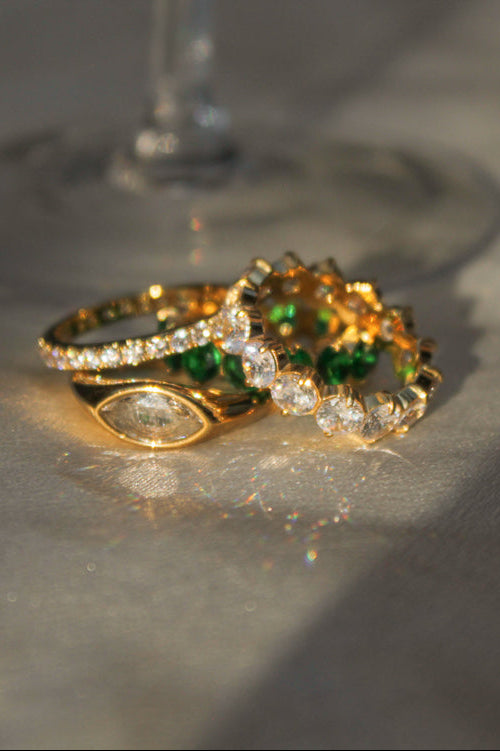 a bunch of gold rings sparkling in the sunlight