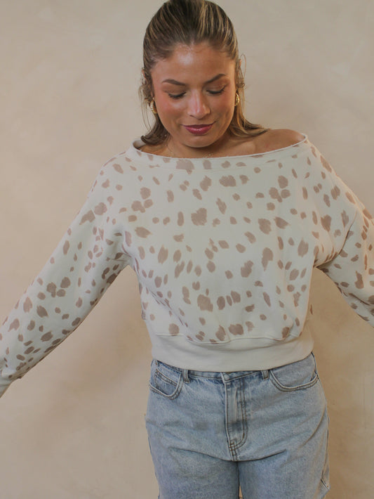 A bambi print off-the-shoulder cropped sweatshirt.
