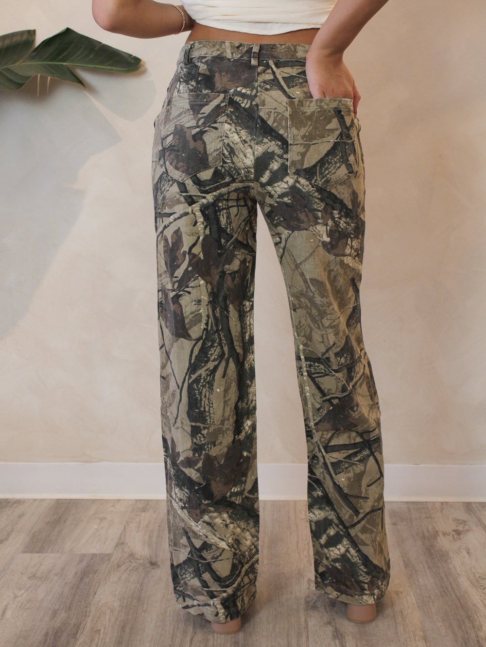 Back view of camo denim with a wide leg, mid-rise fit for a cool girl outfit