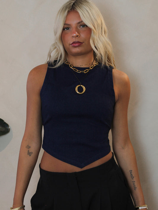 Dark denim sleeveless top with a pointed hem