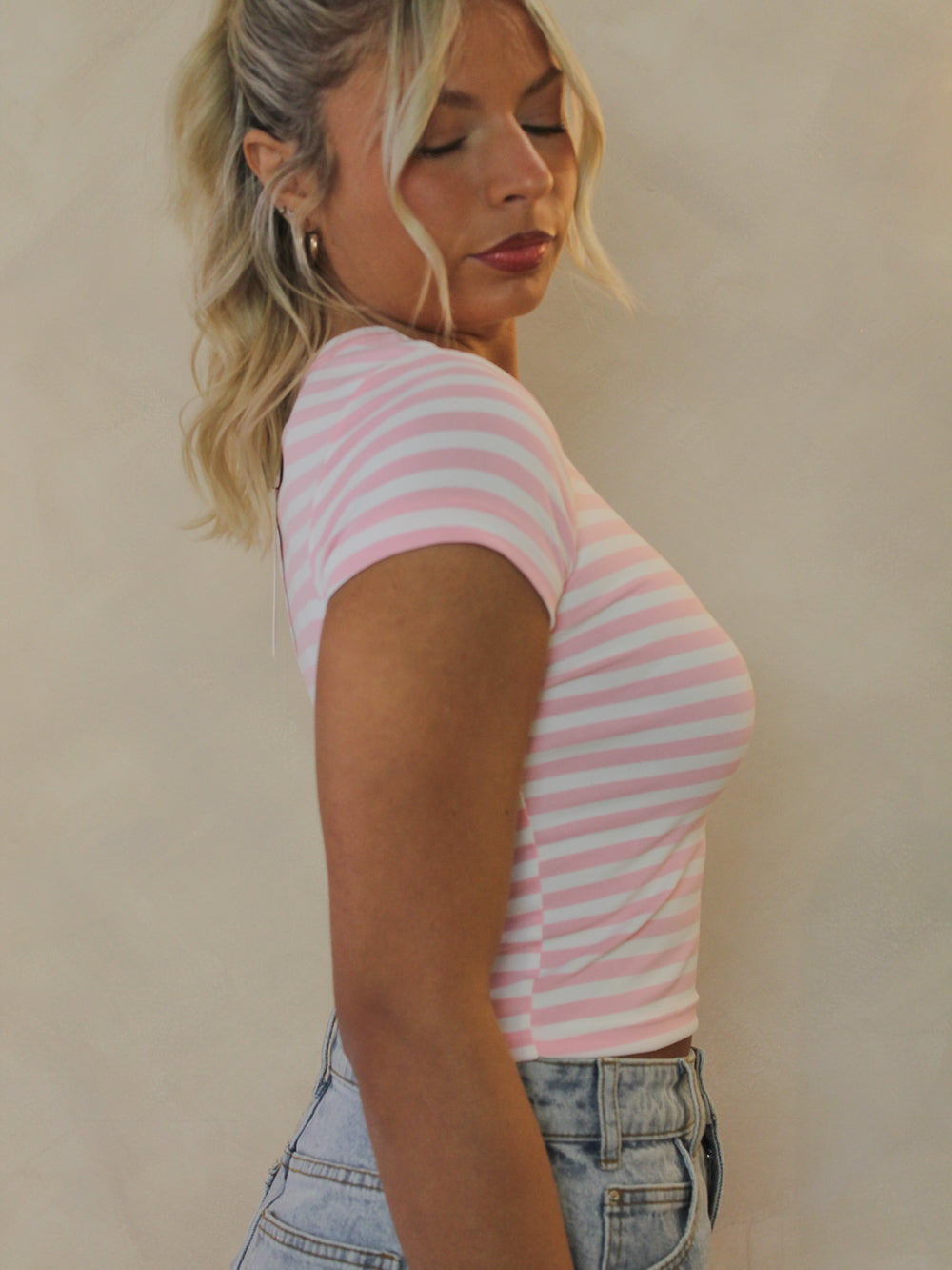 Side view of a pink and white striped top