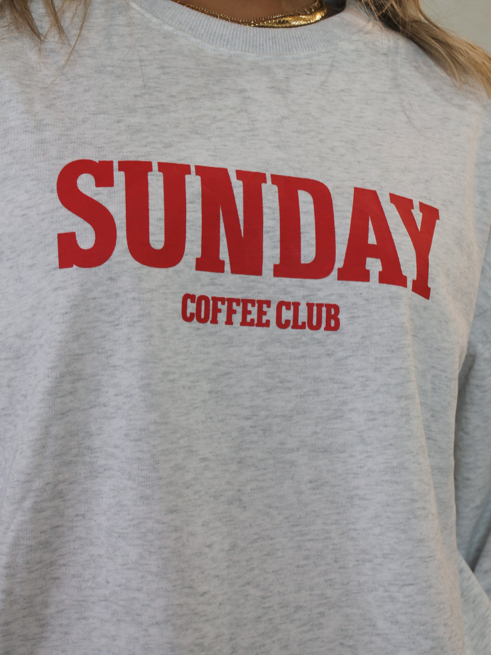 Gray sweatshirt with red 'SUNDAY COFFEE CLUB' text