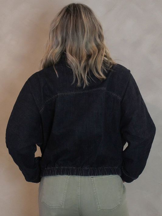 Woman wearing a boxy style denim jacket