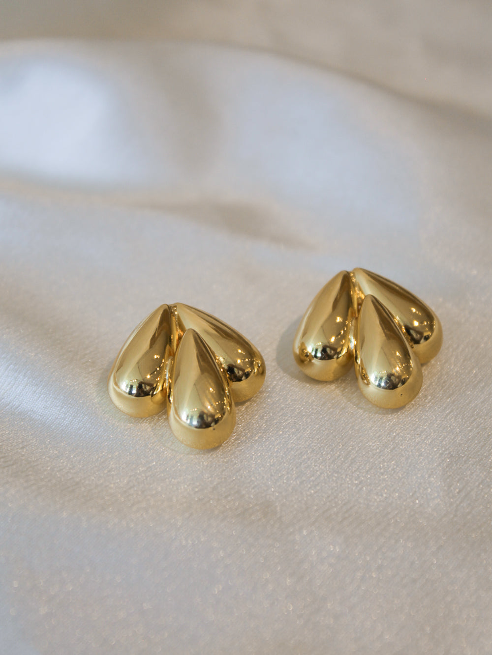 Gold triple teardrop statement stud earring