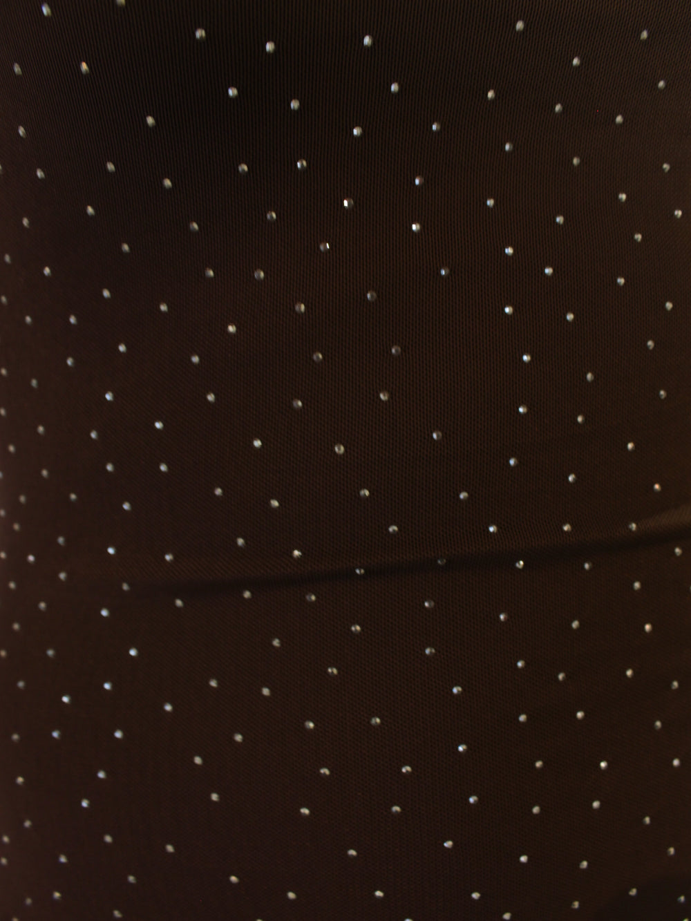 Detail view of brown mesh dress with all over silver stones