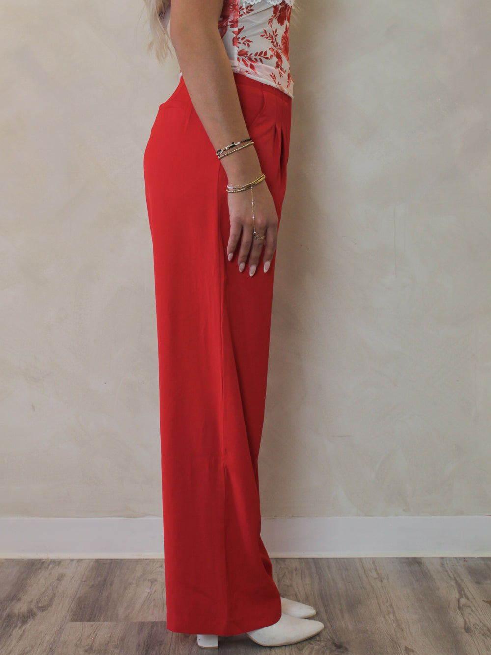 Side view of red wide leg trousers