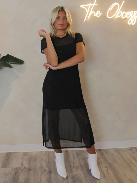 Sheer mesh black dress with short sleeves, side slits and black slip underneath