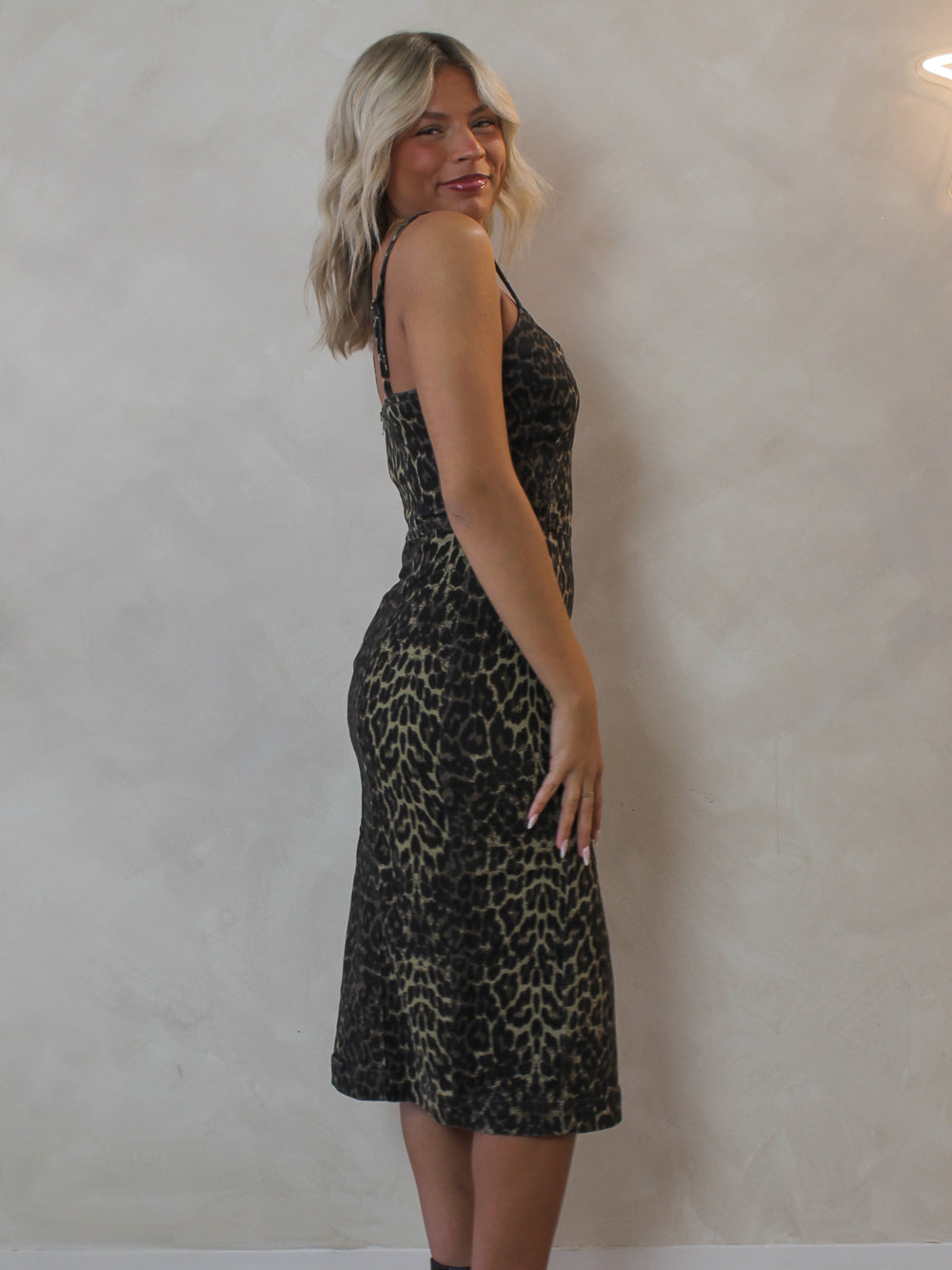 Woman wearing the Steve Madden Giselle Denim Dress in a leopard print