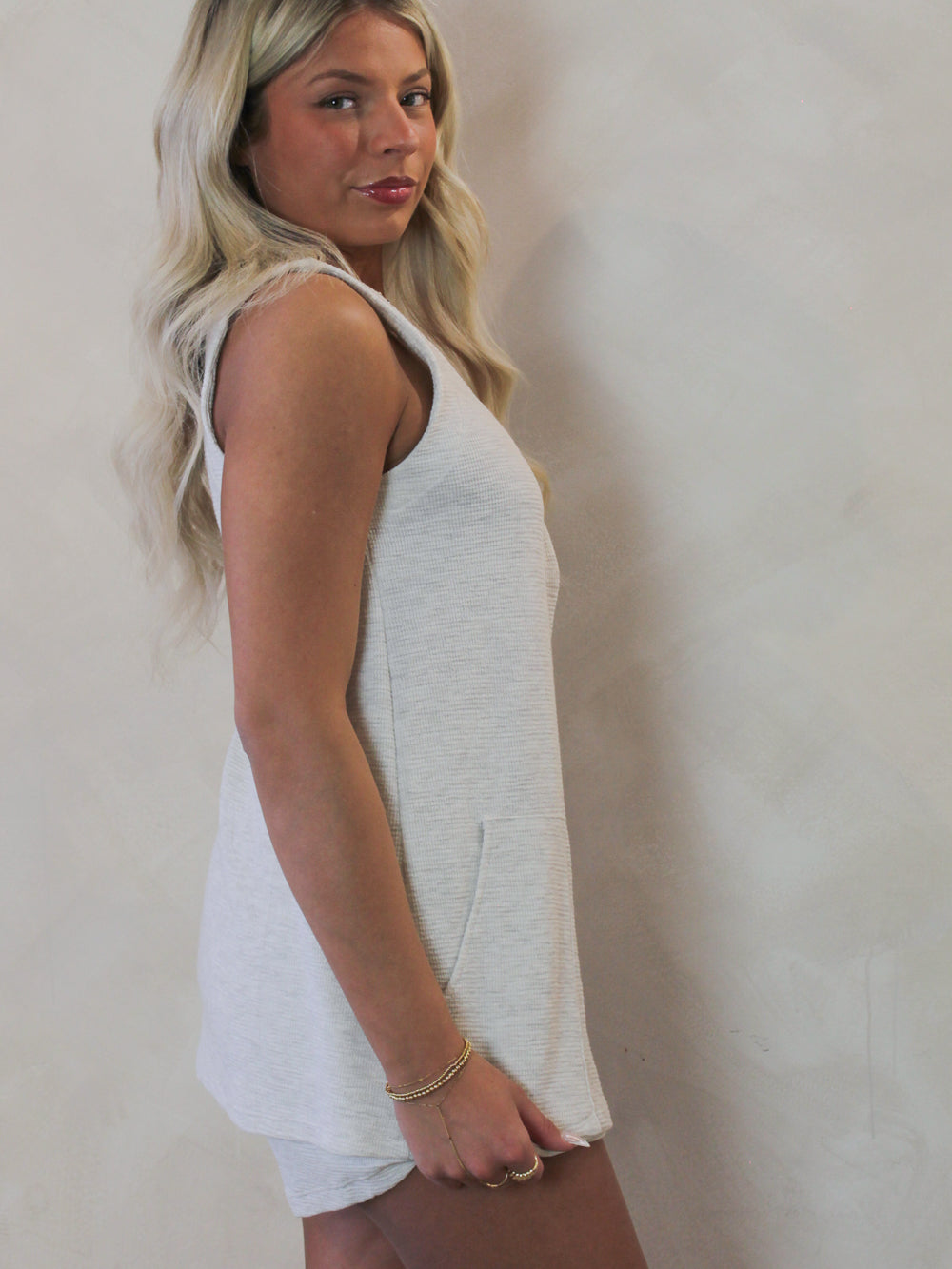 Model wearing a light weight, grey vest