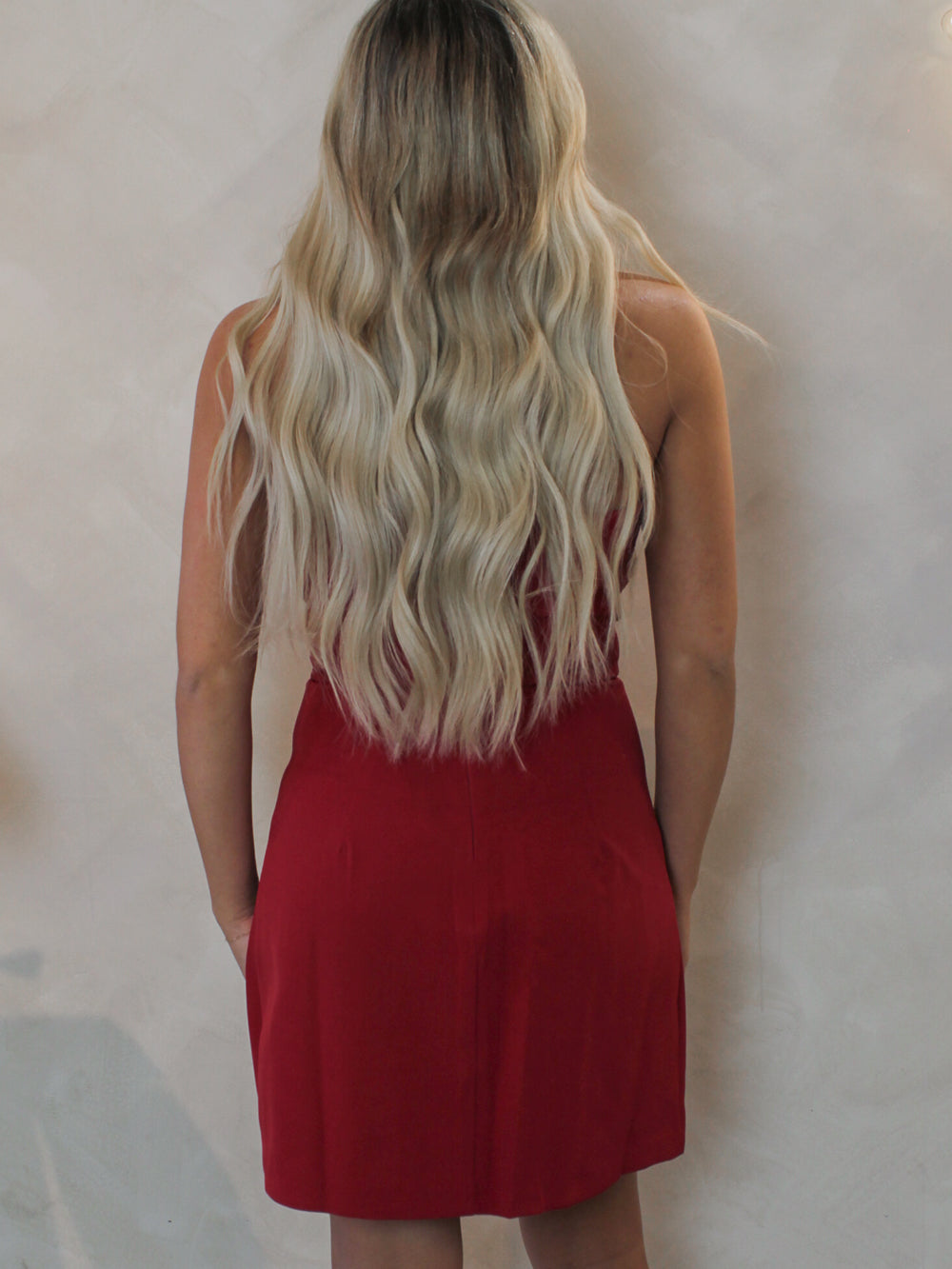 Woman wearing a red strapless short dress