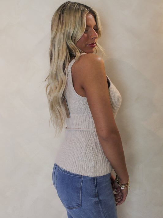 Woman wearing a sleeveless knit tank