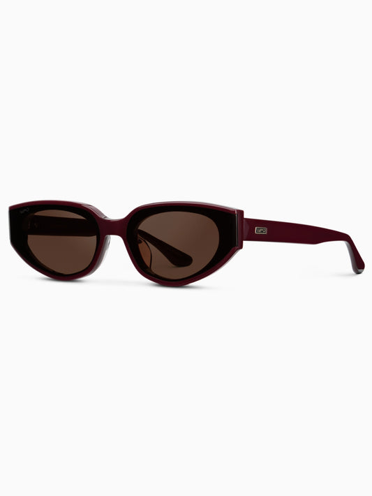 Narrow cat eye sunglasses in a cherry red color with brown lenses