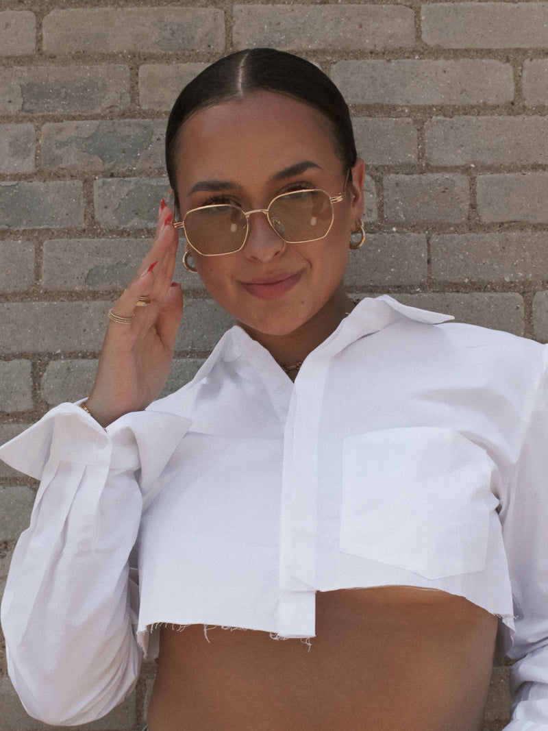 Girl wearing Gold Sunglasses