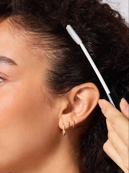 Woman using the Kitsch Taming Wand 