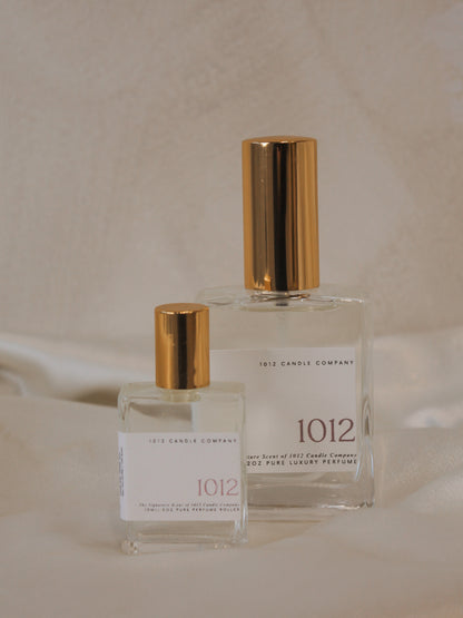 Two luxury organic perfumes in various size, clear glass bottles with gold tops by 1012 Candle Co 
