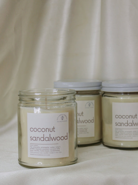 Three jars of coconut sandalwood candles by 1012 candle co 