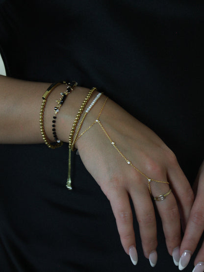 GOLD BLACK AND BEADED BRACELET STACK 