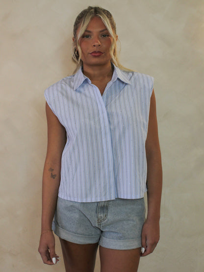 Sleeveless women's pinstripe button up top with subtle rhinestone details all over