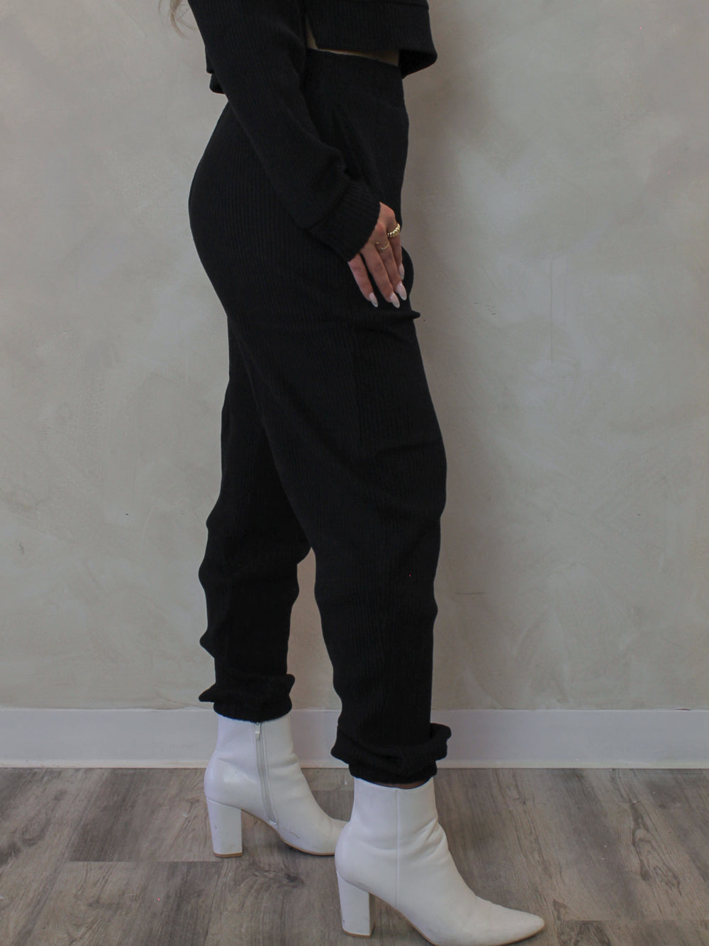 Model wearing black, ribbed, lounge jogger pants