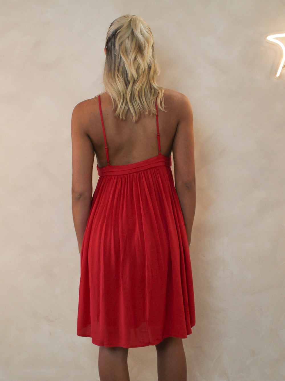 Back view of a short red, summer dress