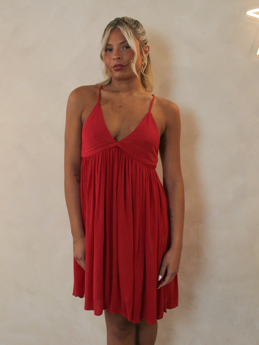 Woman wearing a short red, summer dress