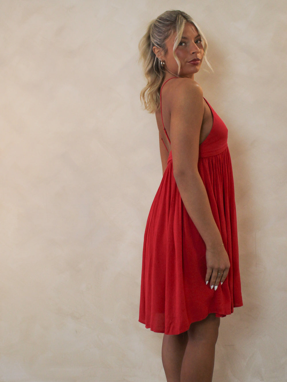 Woman wearing a short red dress for summer