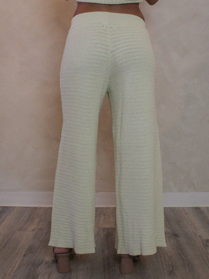 Back view or light green knit pants for woman