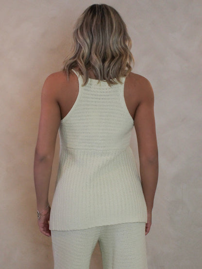 Woman wearing a light green knitted outfit