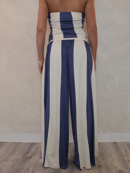 Back view of blue and cream striped pants for women.