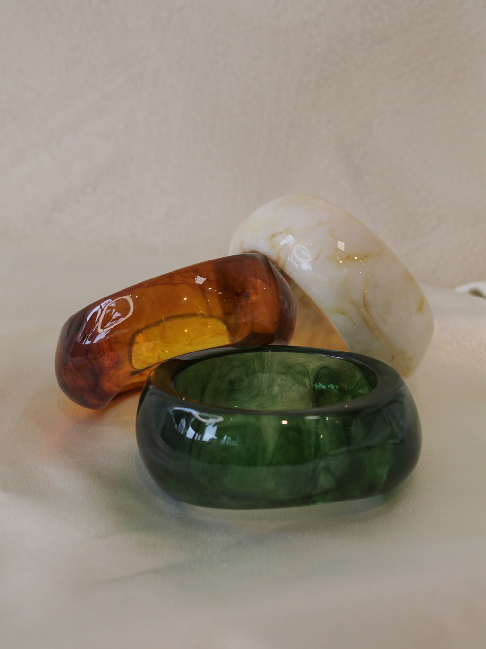 Three chunky resin bangle bracelets