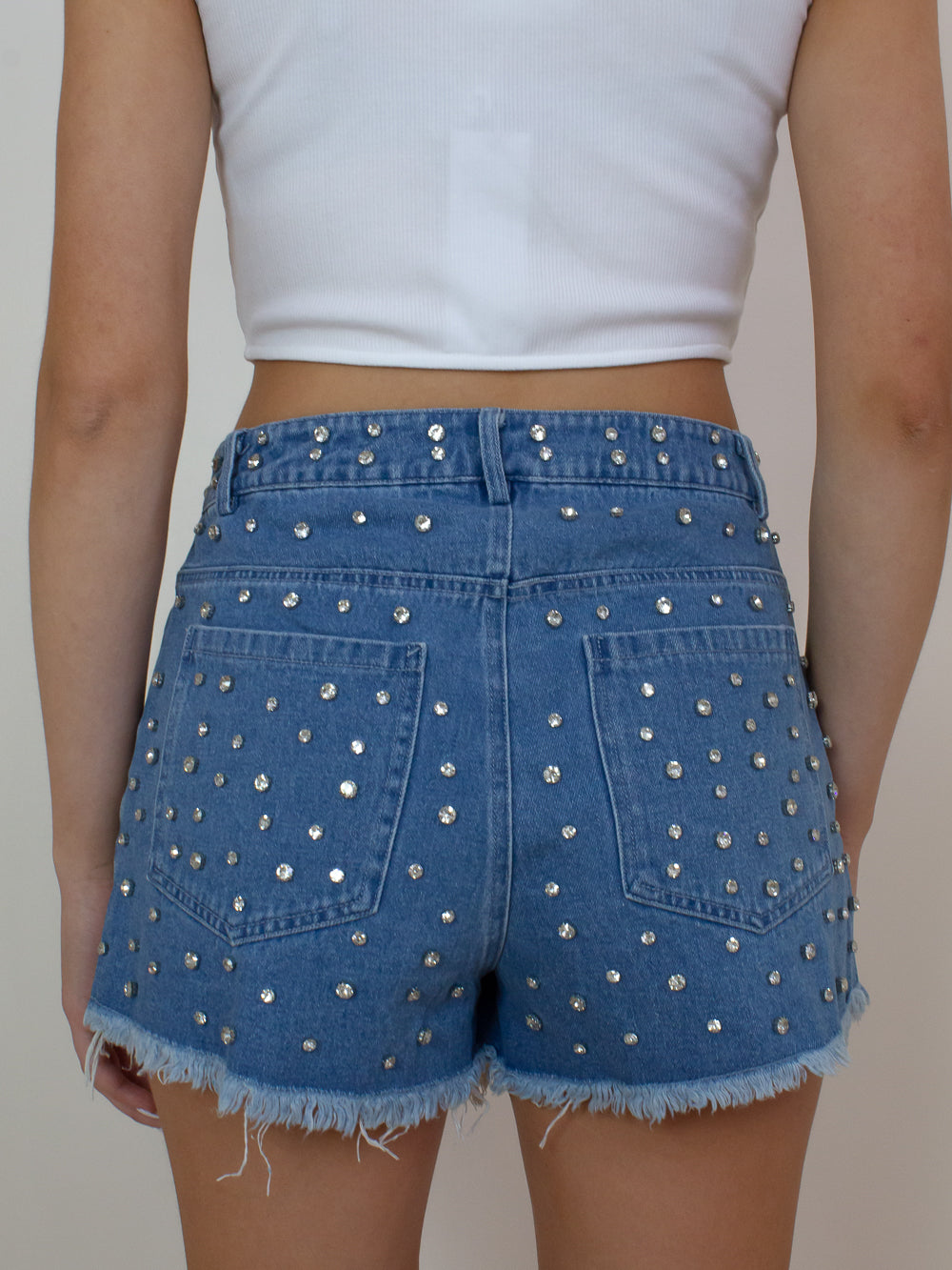Cute denim shorts with all over rhinestone details and frayed hems 