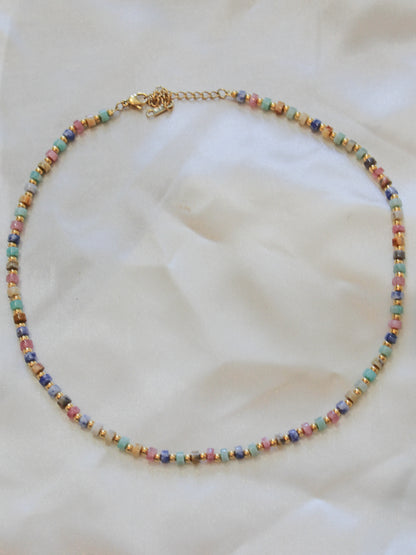 A delicate beaded necklace with small multicolored beads.