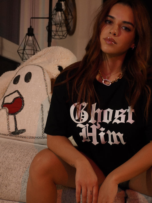 Woman wearing a black halloween t-shirt with 'Ghost Him' text