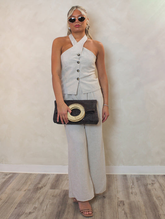 Linen matching pants set styled with a brown woven clutch and gold accessories outfit 