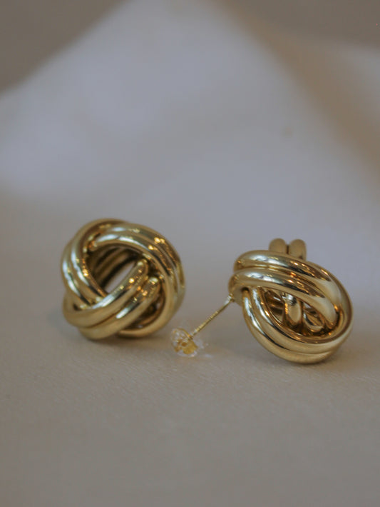 A pair of Gold knot stud earrings