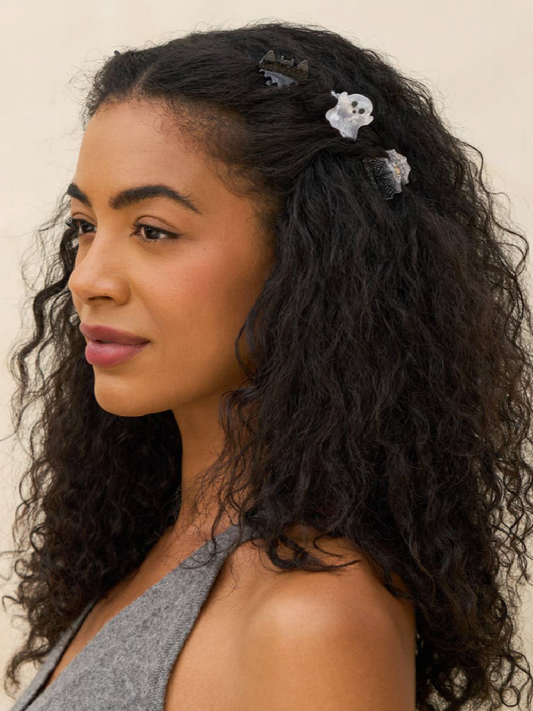 Woman wearing mini halloween claw clips 