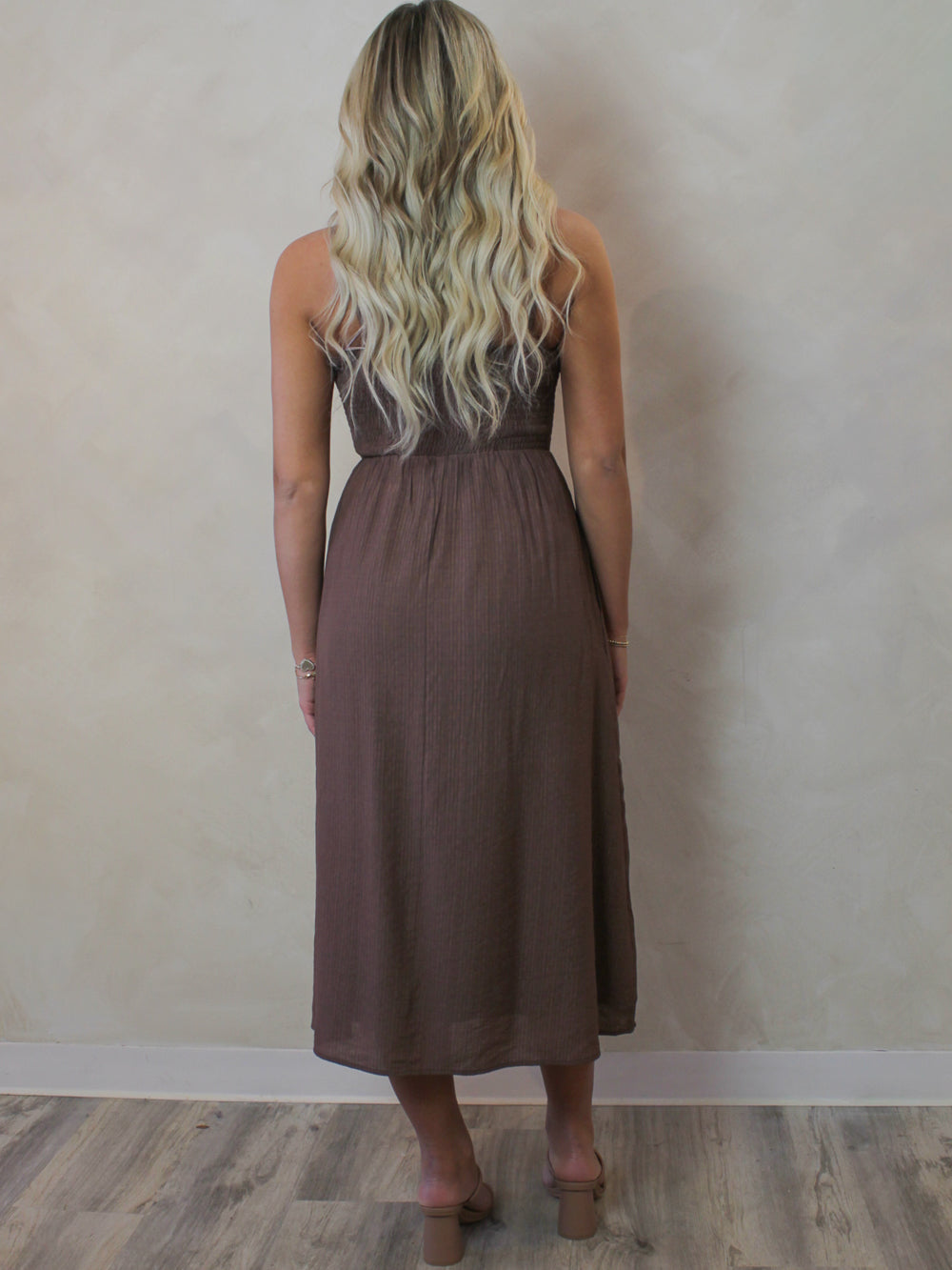 Woman wearing a brown midi dress for spring