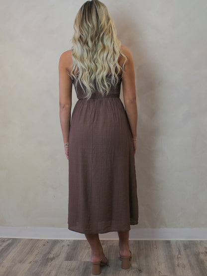 Woman wearing a brown midi dress for spring
