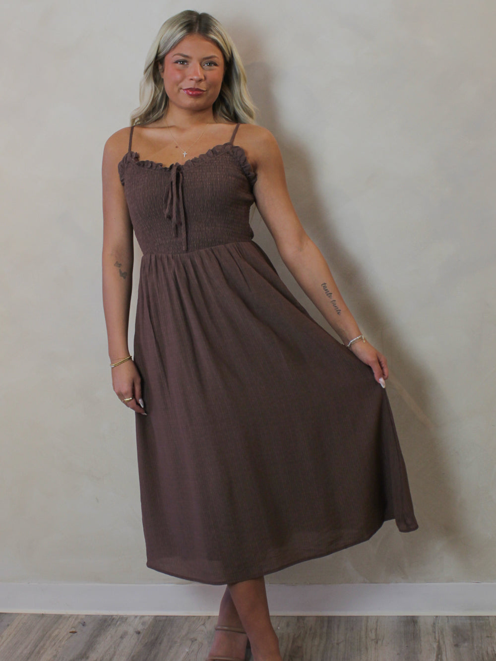 Model wearing a brown smoked midi dress for spring 