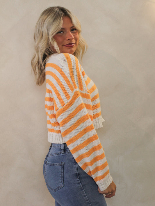Cozy orange and white cropped sweater