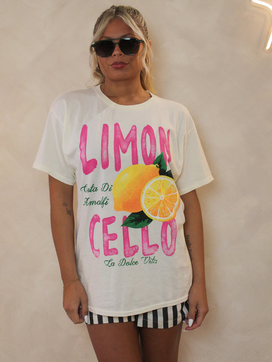 Model wearing a loose fitting tee with the 'Limoncello"  and lemon graphics