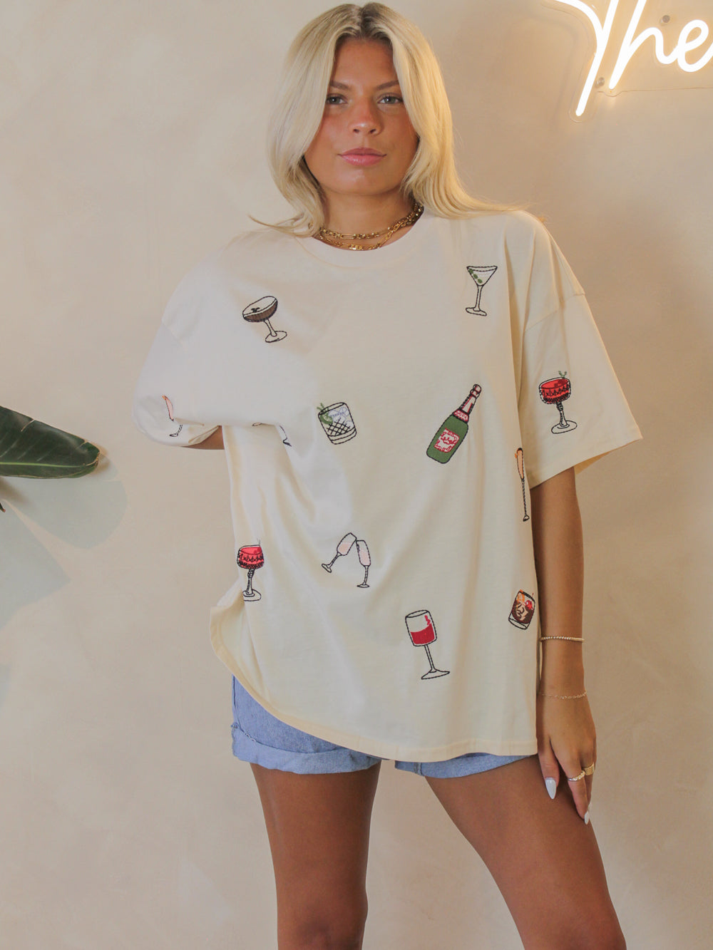 Fun, oversized graphic tee with various drinks embroidered all over for a laid back look
